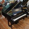 Hopkinson baby grand piano for sale, finished in a black case.