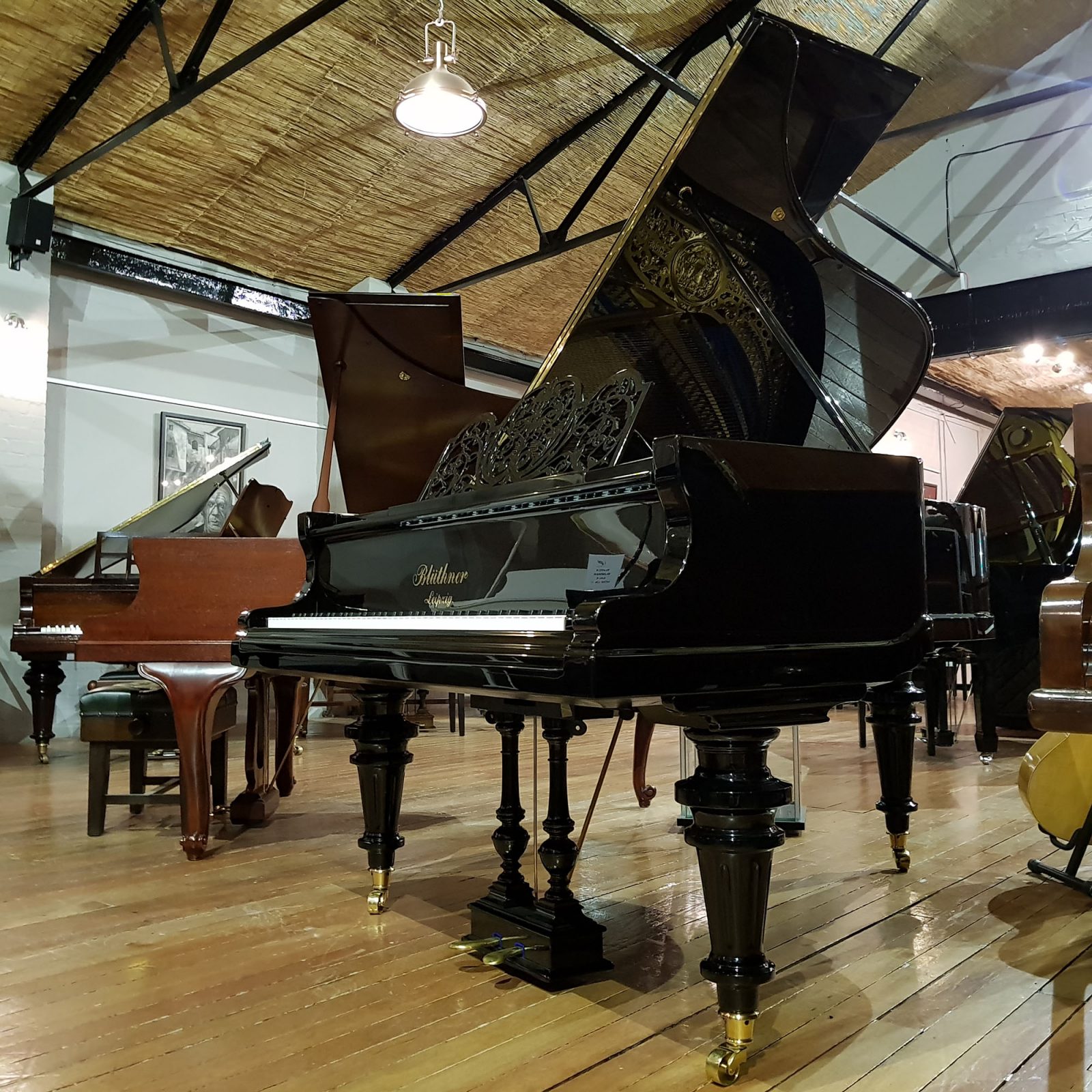 Restored Bluthner grand piano, Jubilee frame, in a black case, for sale.
