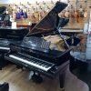 Restored Bluthner concert grand piano, in a black polyester case for sale.