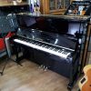 Used Yamaha U1 upright piano, in a black polyester case, for sale.