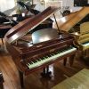 Kirkman Baby Grand Piano, finished in a mahogany case, for sale.