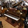 Allison baby grand piano for sale, in a mahogany case.