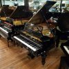 Restored Bechstein Model A grand piano for sale, in a black case.