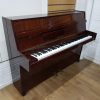 Used Neindorf upright piano, in a mahogany case, for sale.