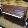 Used Yamaha E108 upright piano for sale in a walnut case.