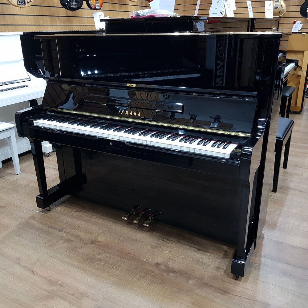 Used Yamaha YUS1 upright piano, in a black polyester case, for sale.