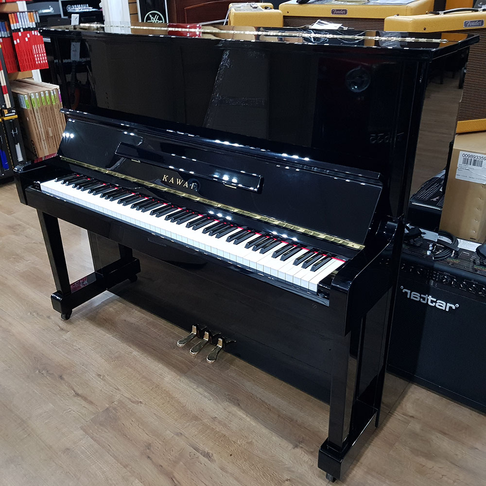 Used Kawai KS-2F upright piano for sale, in a black polyester case.