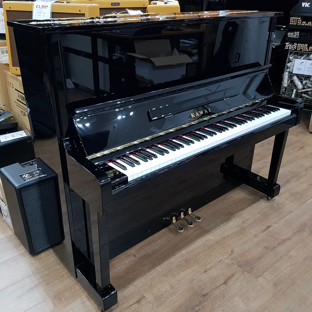 Used Kawai NS-10 upright piano for sale, in a black polyester case.