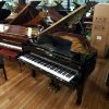 Young Chang TG-150 baby grand piano, in a black case, for sale.